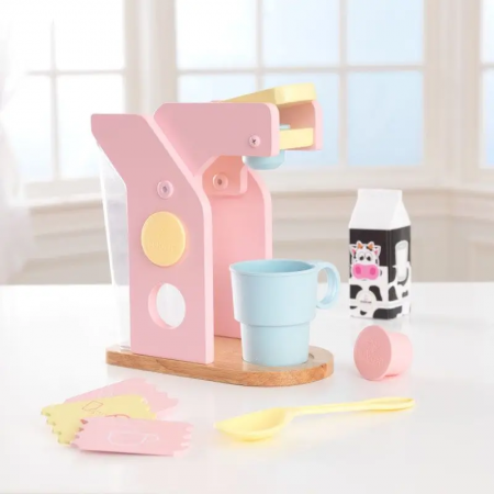 Pastellfarbene Spielzeug-Kaffeemaschine aus Holz von KidKraft mit Kapseln und Küchenzubehör für Kaffee.